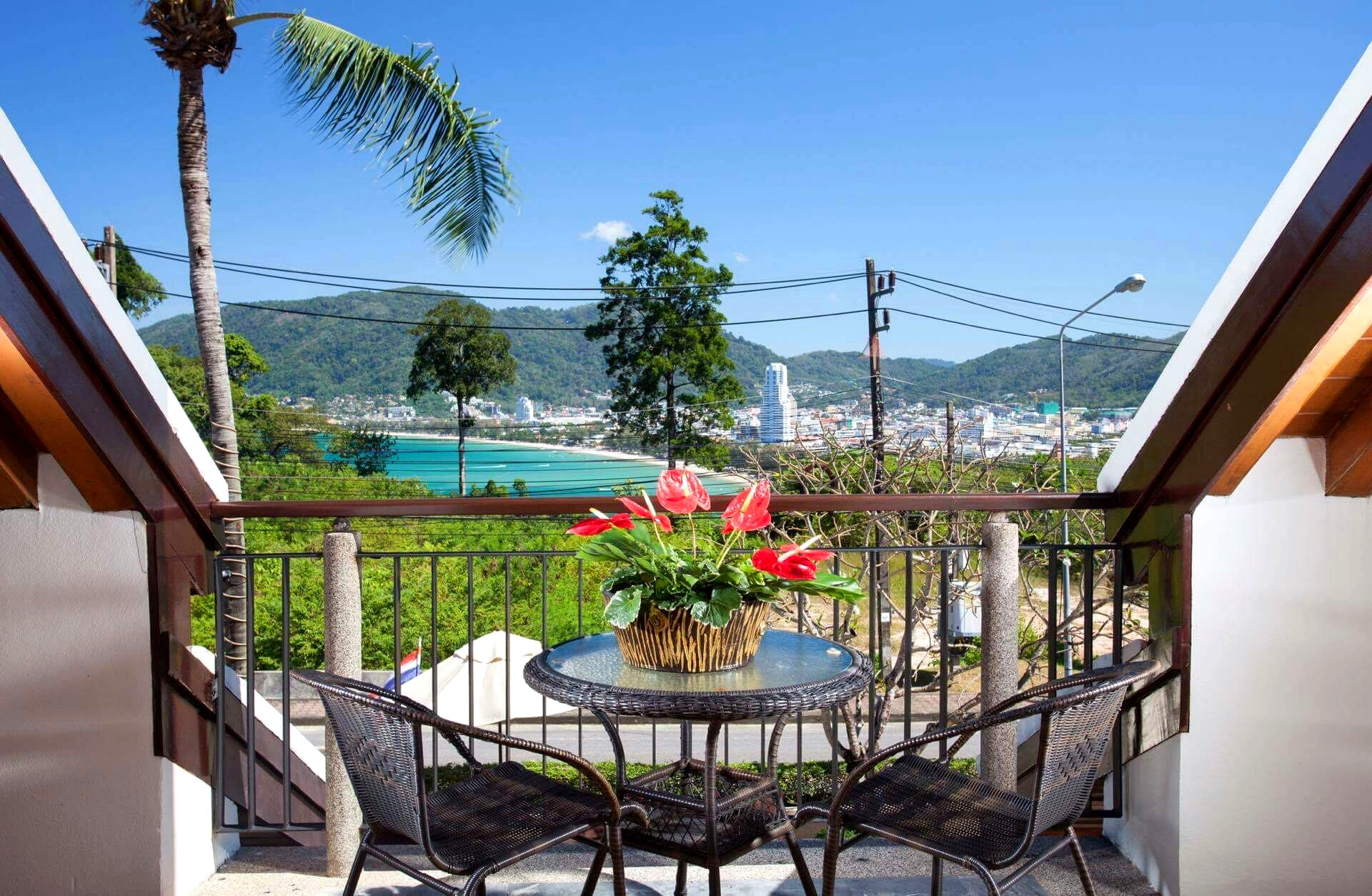 Balcony with flowers and bay view