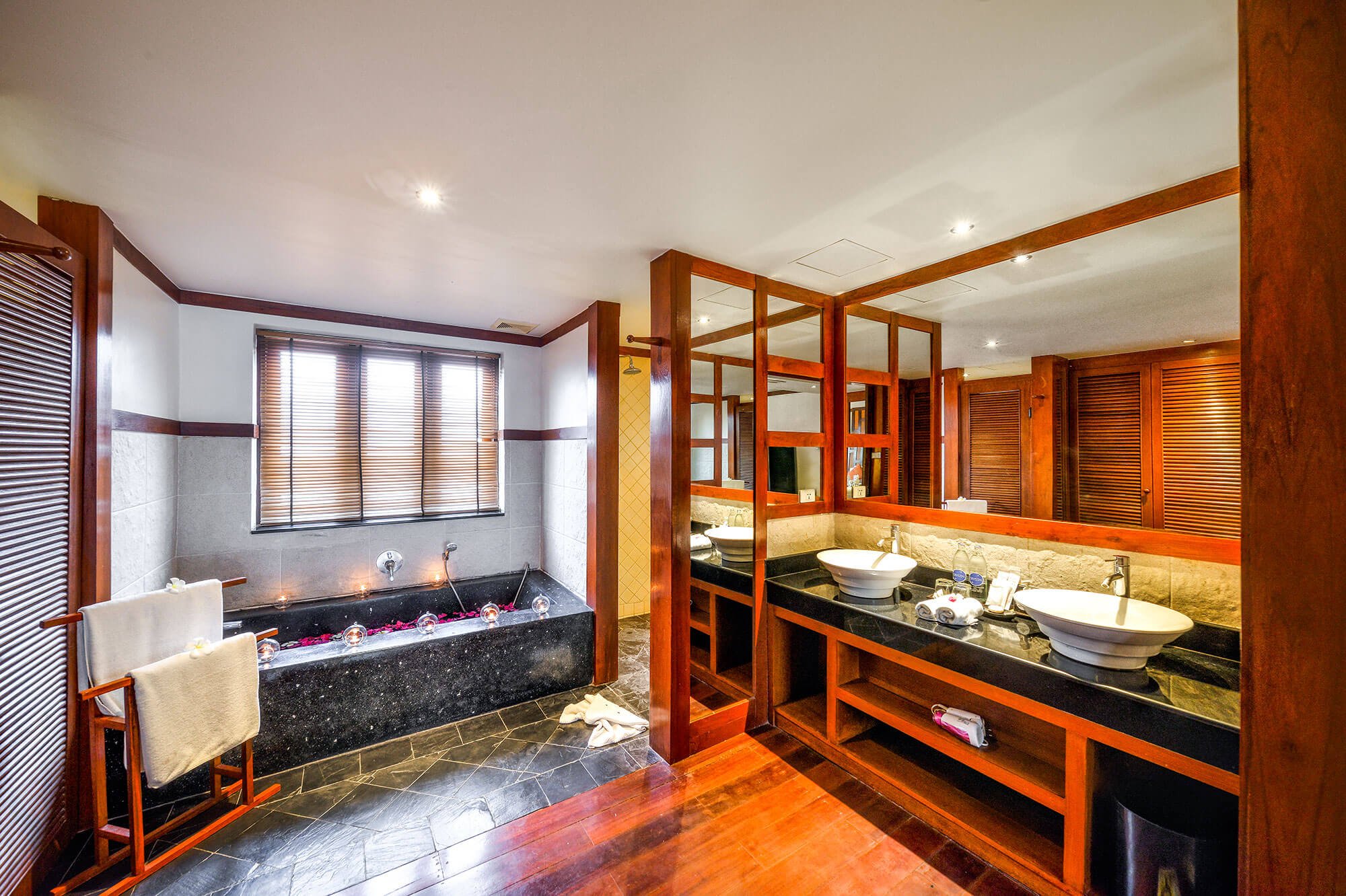 Teak bathroom with slate tub