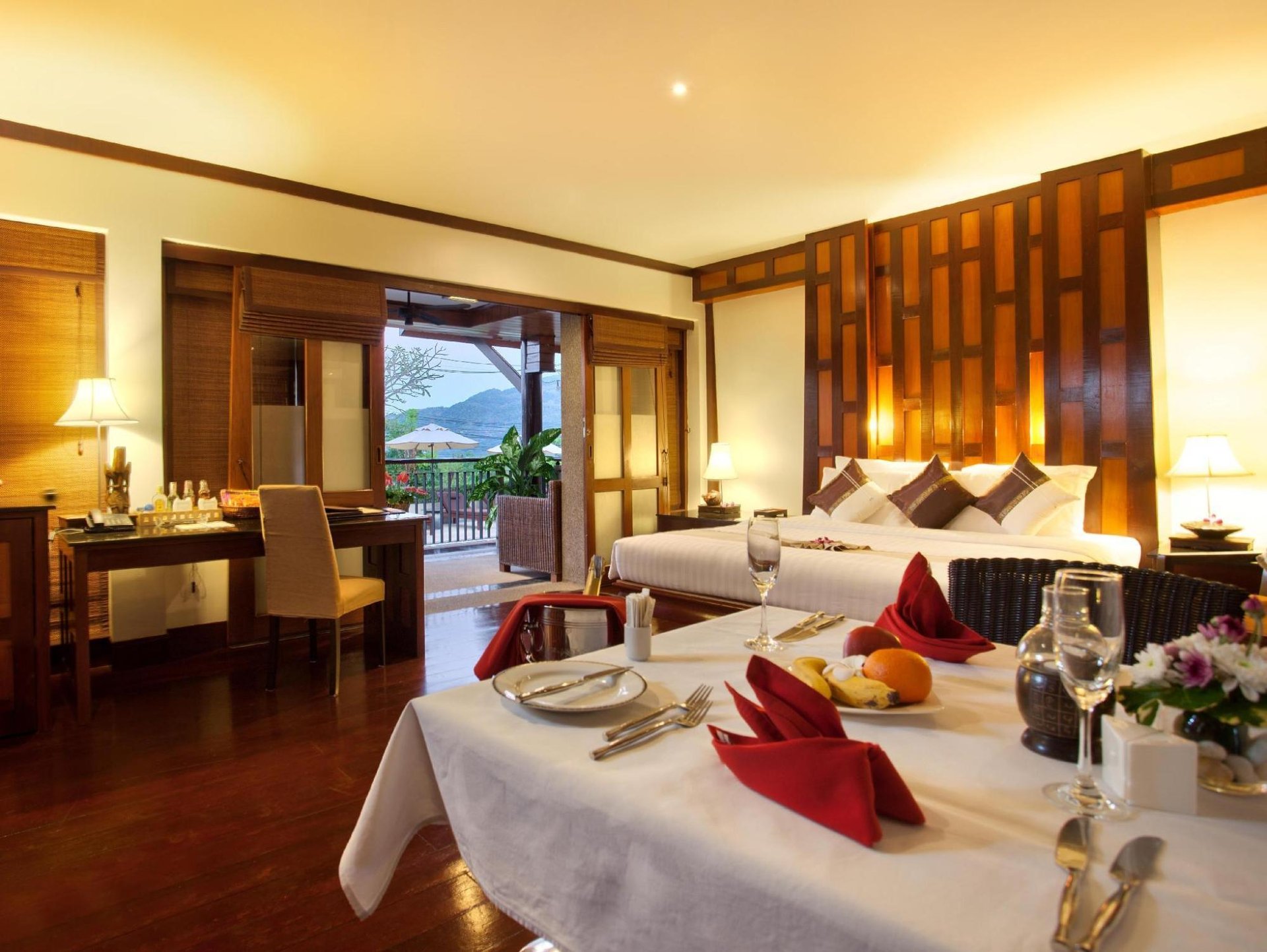 In-room dining setup with bay view through the balcony
