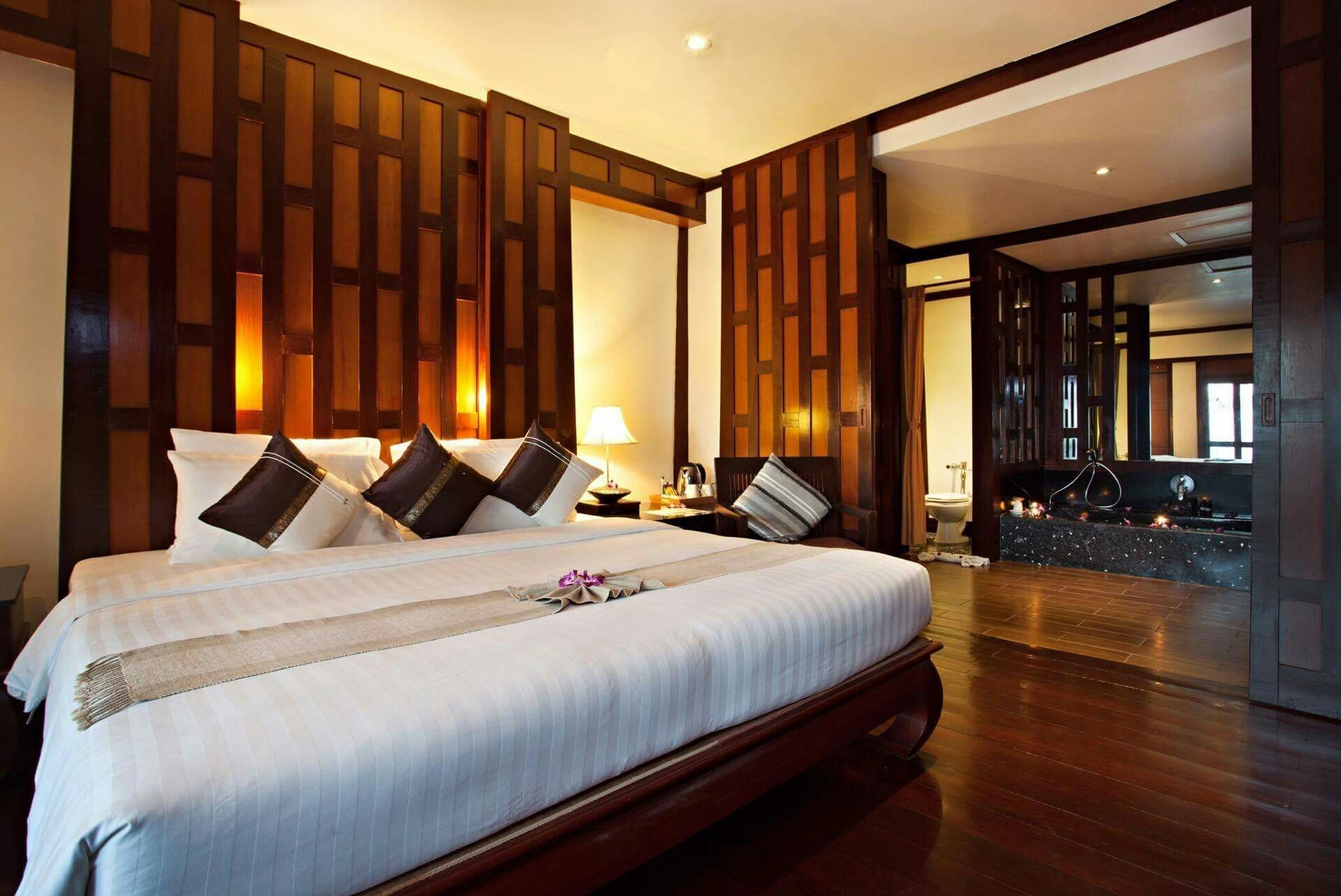 Teak king with slat headboard and bathroom view