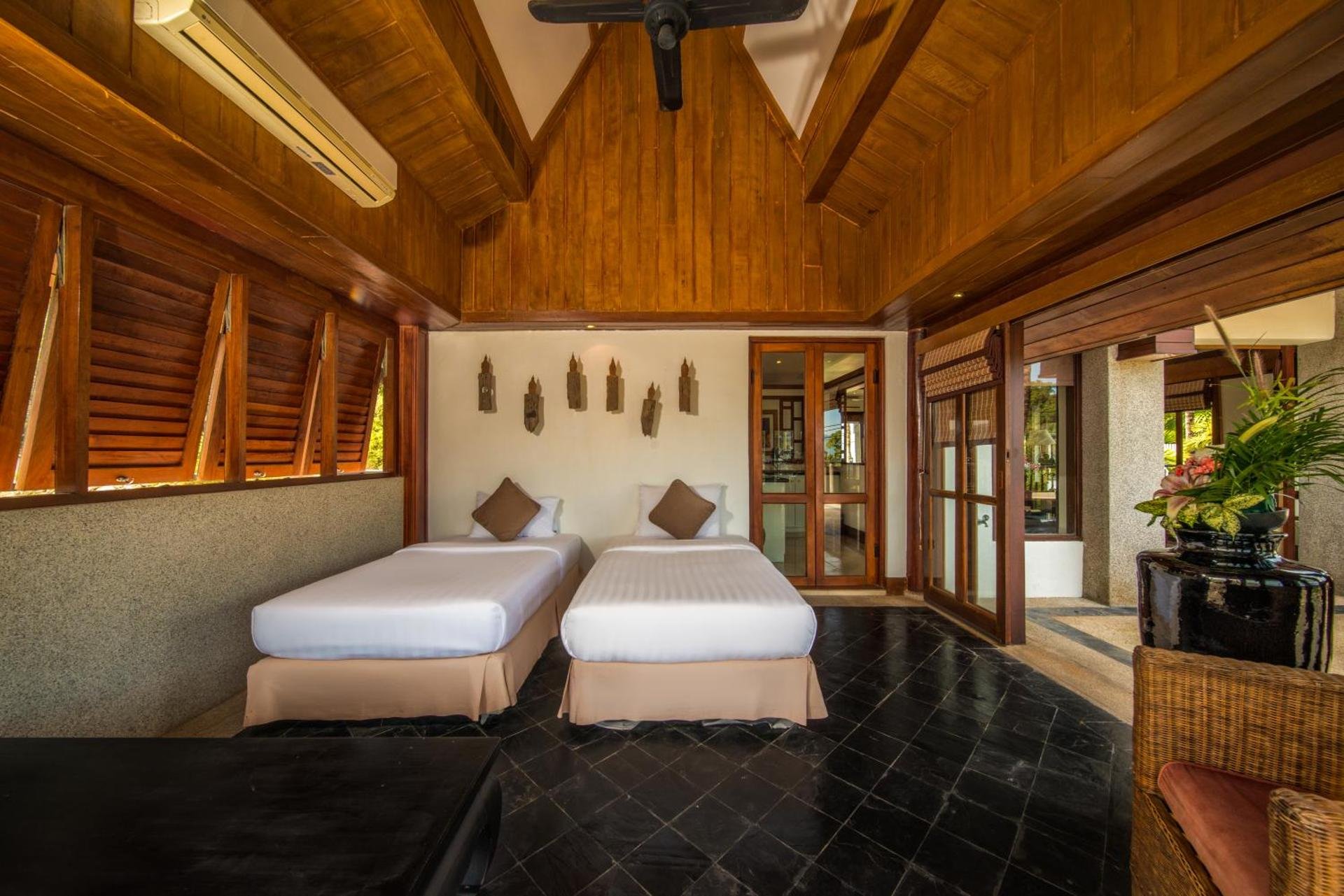Pitched teak-ceiling suite with twin beds