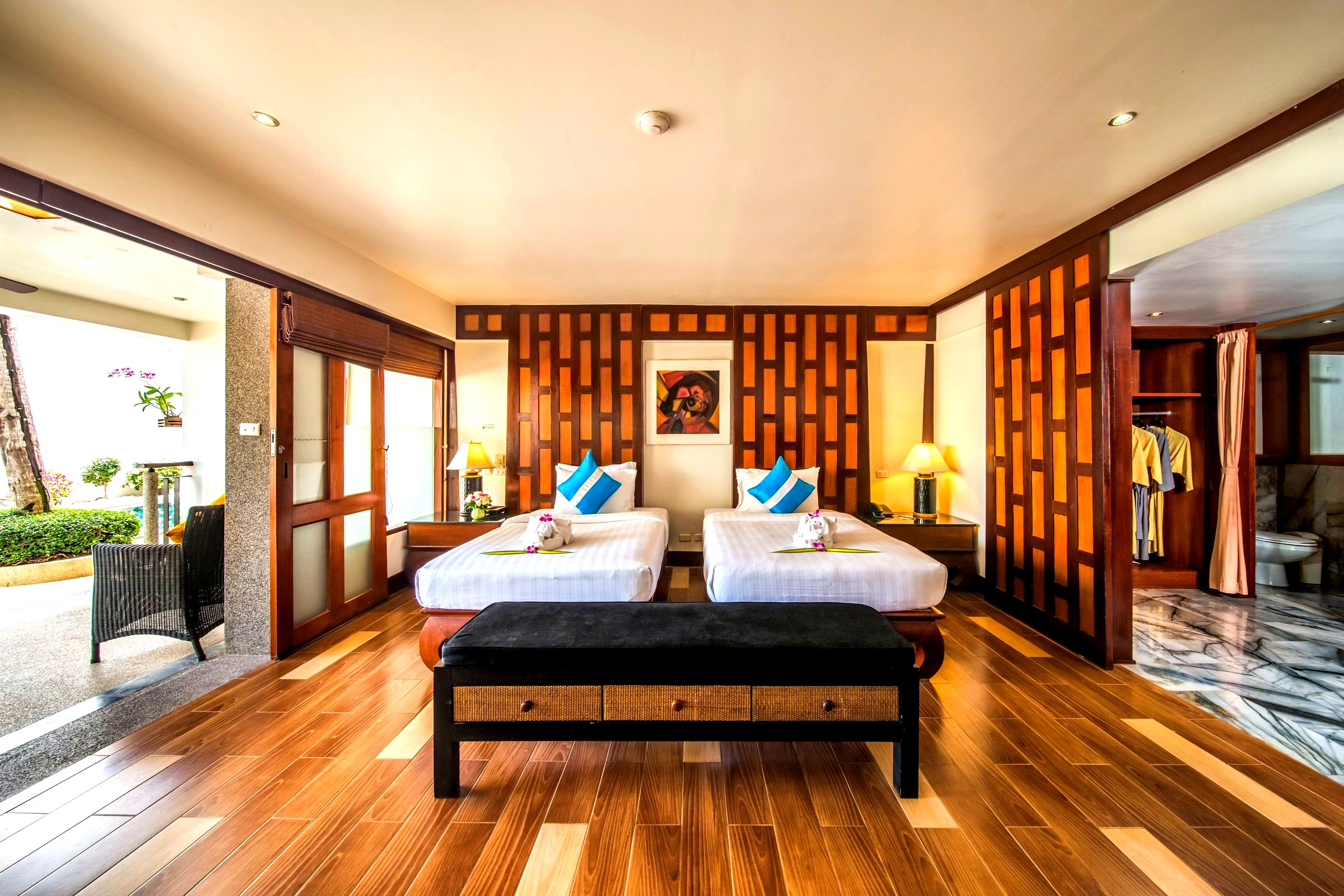 Pool Suite upper level with twin beds and hardwood screens